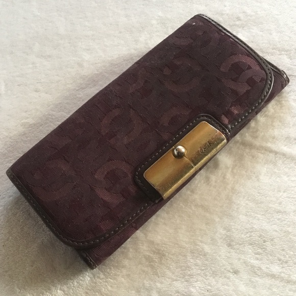 Purple Coach monogram leather & canvas wallet